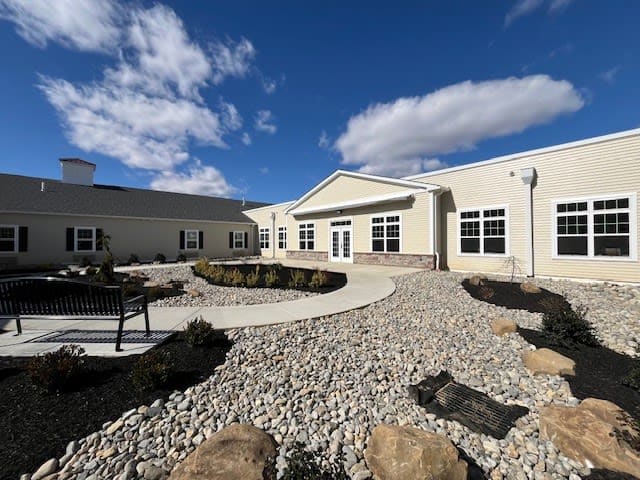 Single-story building with landscaped courtyard and walkway