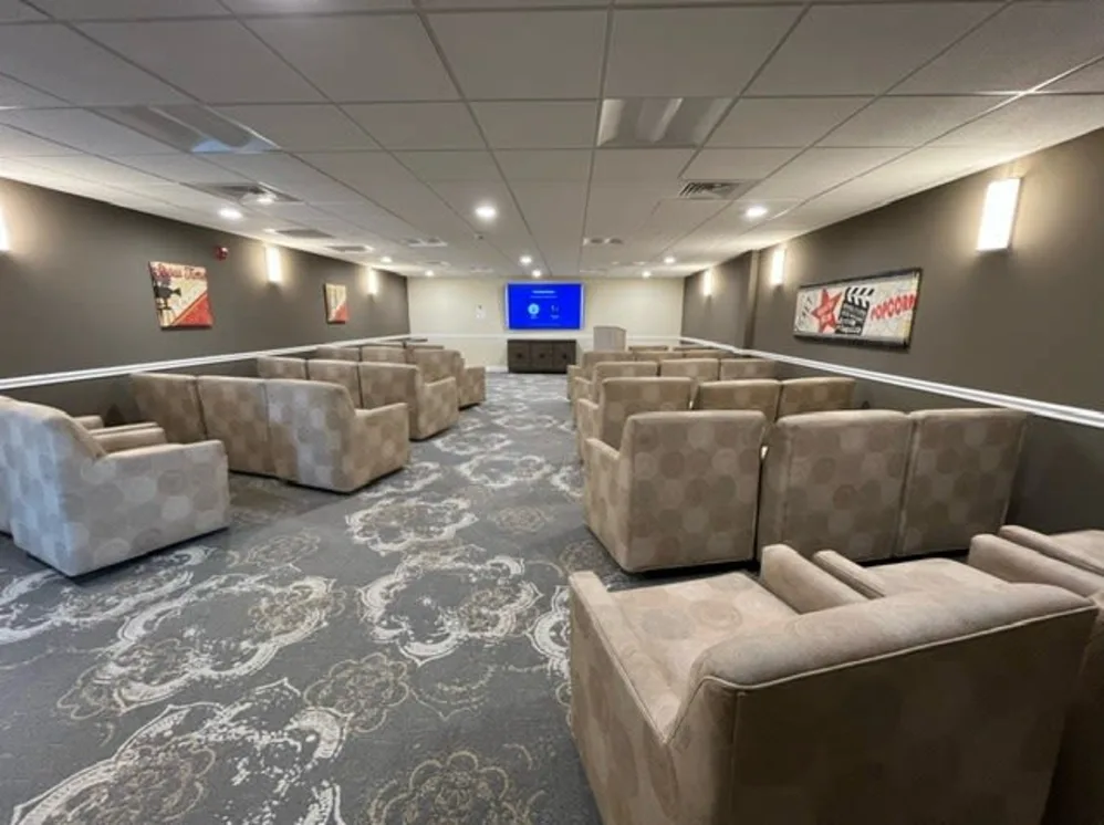 Private theater room with armchairs and large screen